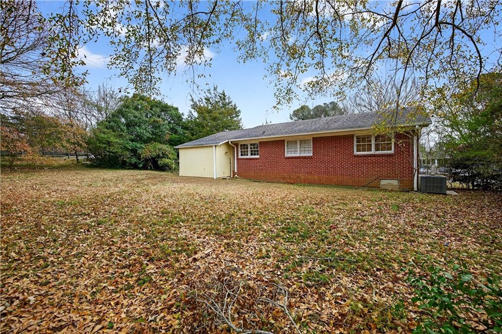1742 Cardinal Road Hampton, GA 30228 - Photo 21 of 25 a front view of house with yard and trees