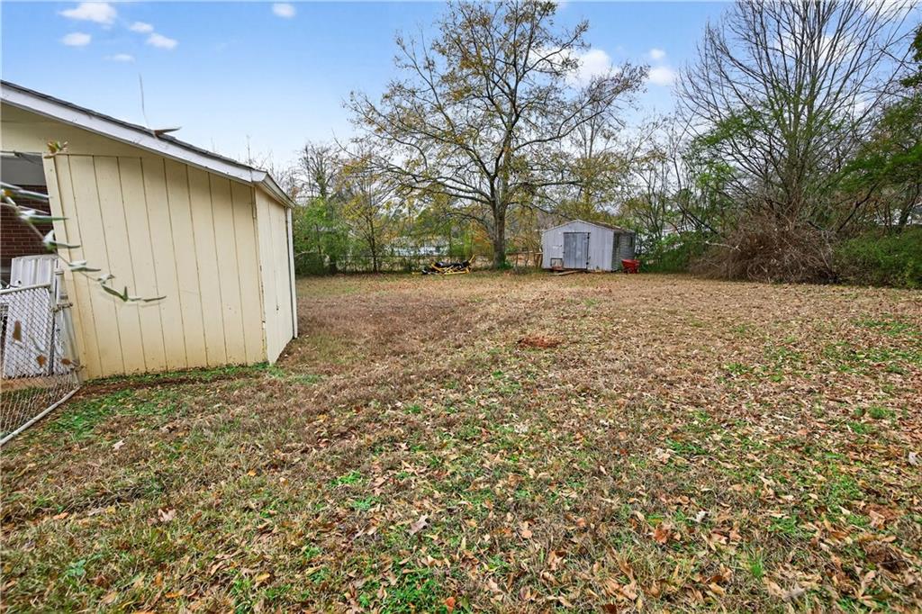 1742 Cardinal Road Hampton, GA 30228 - Photo 23 of 25 a house with trees in front of it