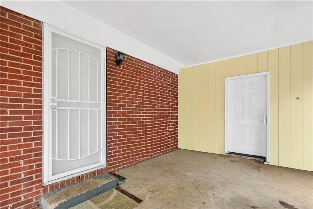 1742 Cardinal Road Hampton, GA 30228 - Photo 3 of 25 a view of an empty room with a door
