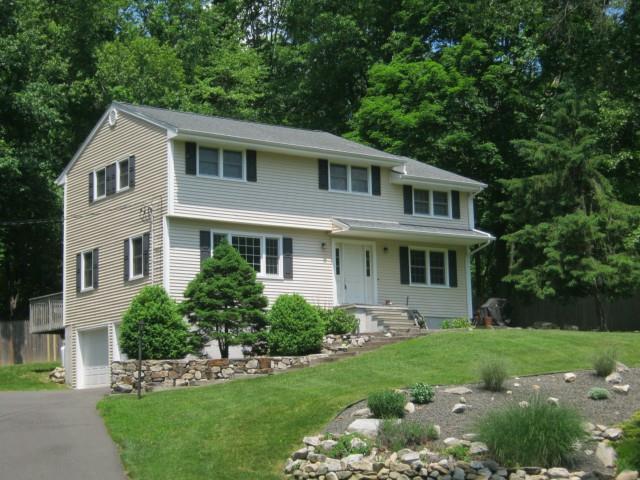39 Florida Hill Road Ridgefield, CT 06877 - Photo 1 of 1 a front view of a house with a yard