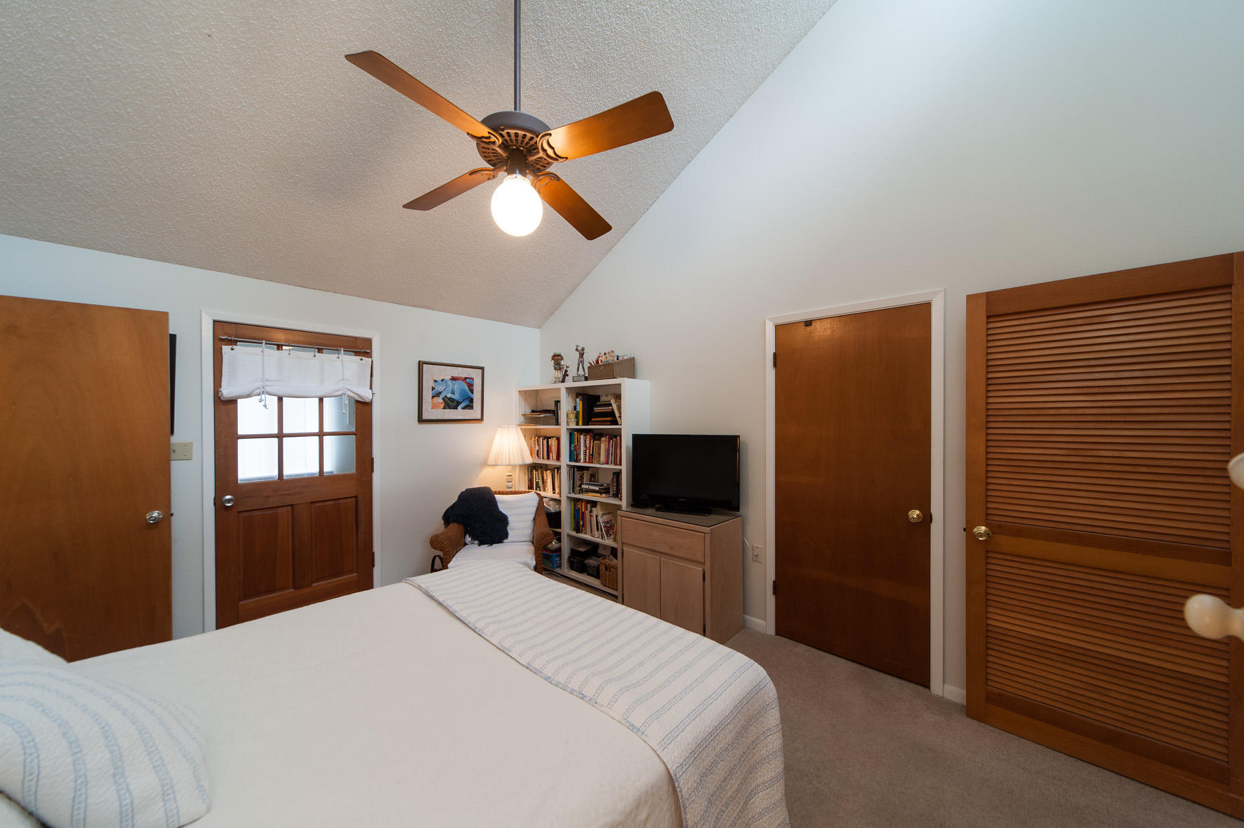 568 Ridge Road Santa Rosa Beach, FL 32459 - Photo 14 of 31 a bedroom with a bed and a flat screen tv