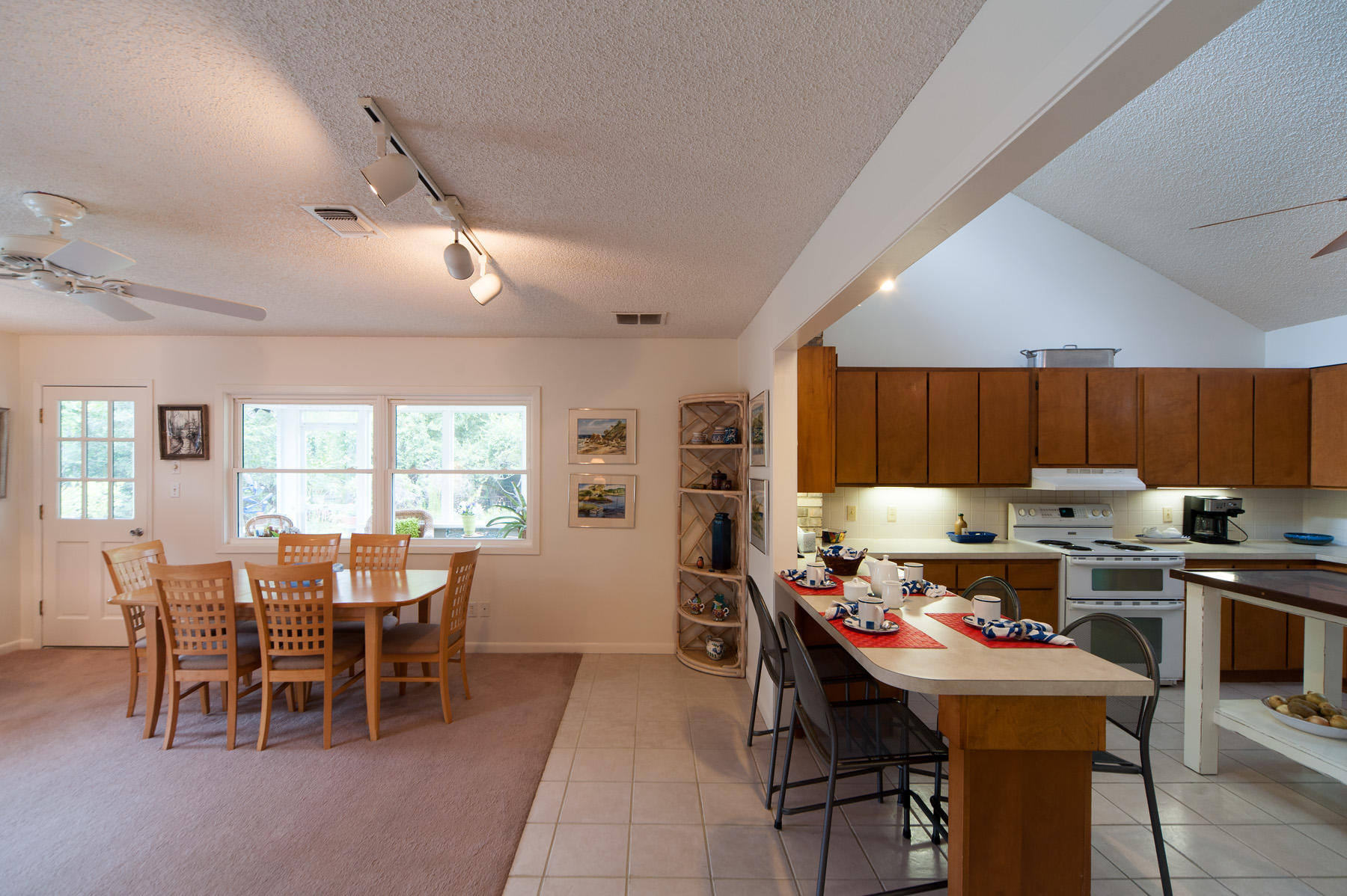 568 Ridge Road Santa Rosa Beach, FL 32459 - Photo 25 of 31 a kitchen with a dining table chairs and large window
