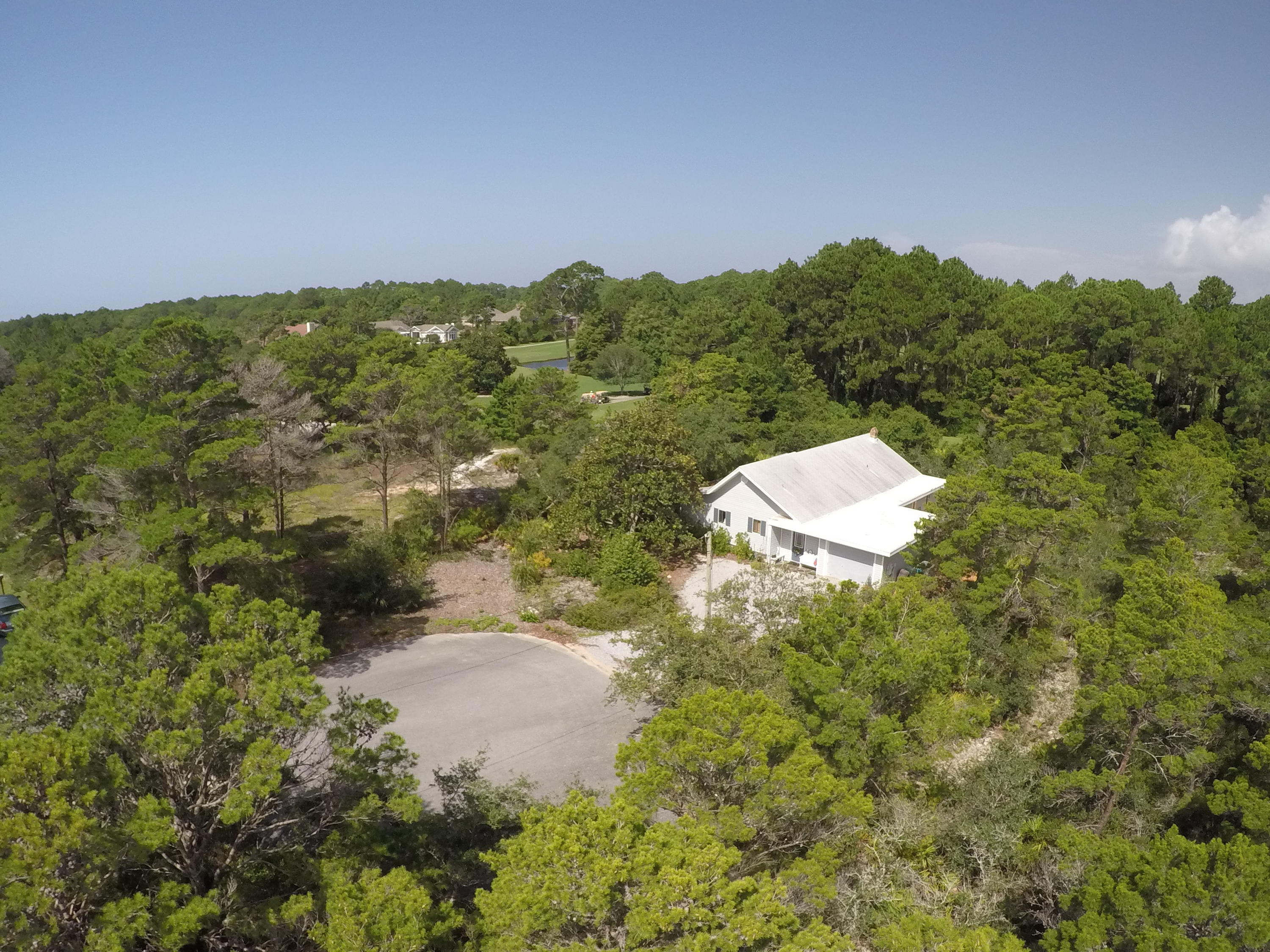 568 Ridge Road Santa Rosa Beach, FL 32459 - Photo 30 of 31 a view of a green field with lots of bushes