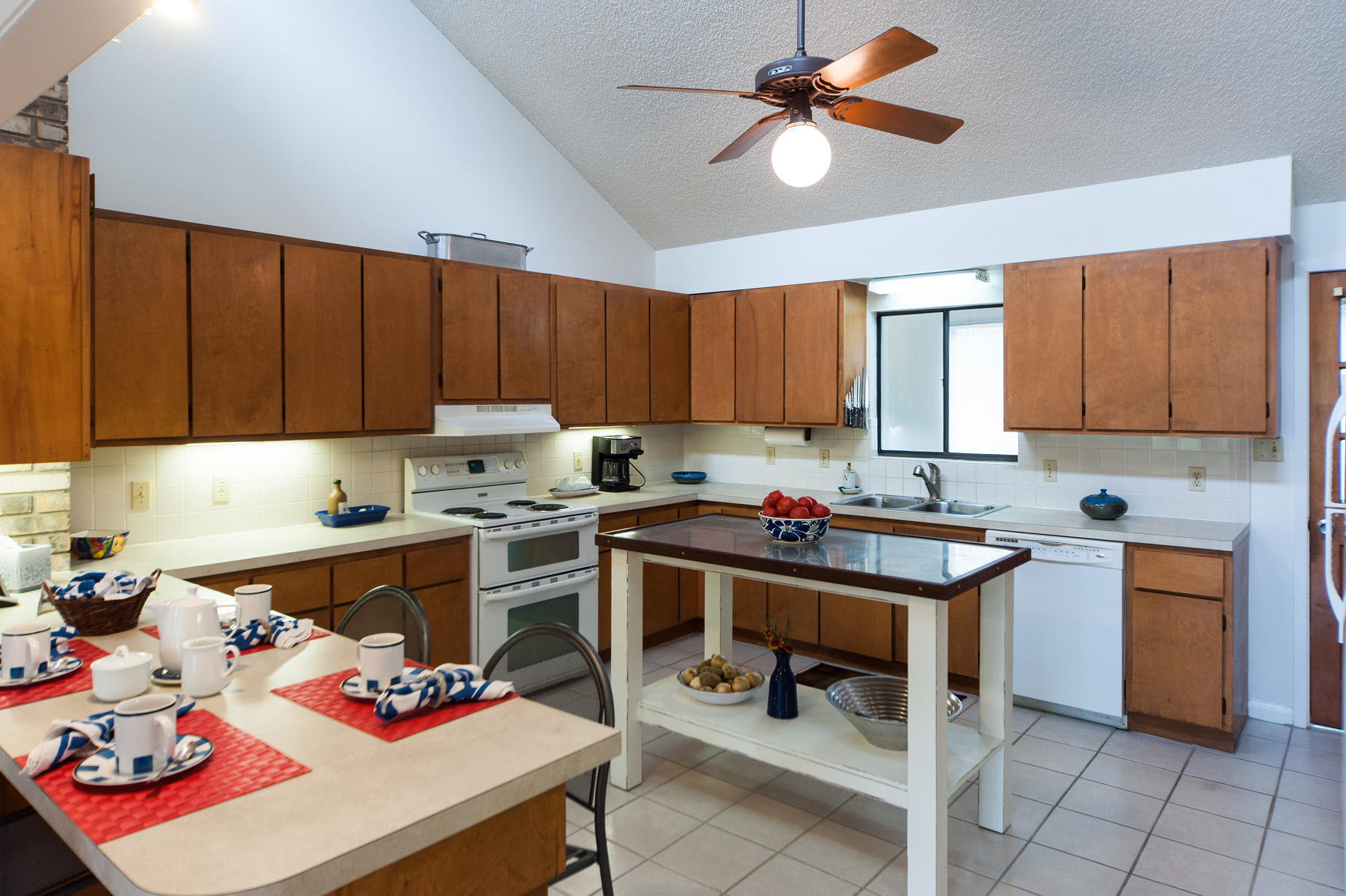 568 Ridge Road Santa Rosa Beach, FL 32459 - Photo 5 of 31 a kitchen with a cabinets appliances and a dining table