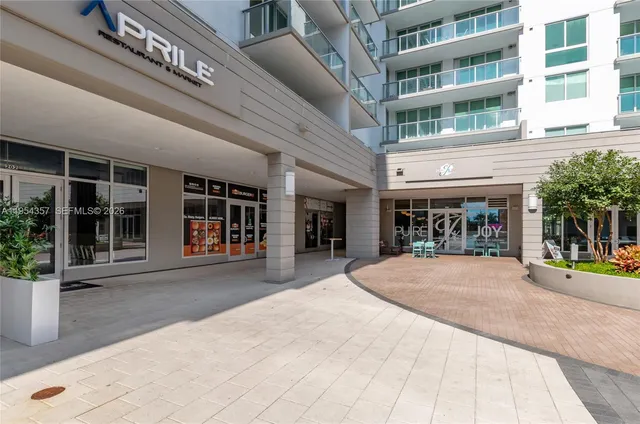 a front view of building with a garden