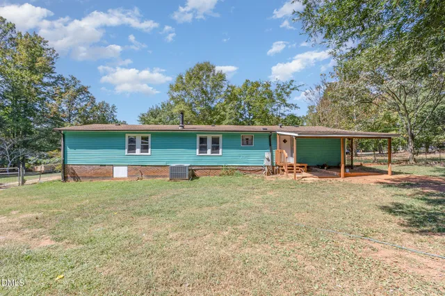 a picture of a bench and a sign on a wall