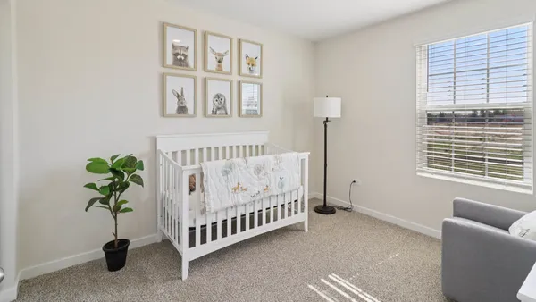 a bed room with a bed and a window