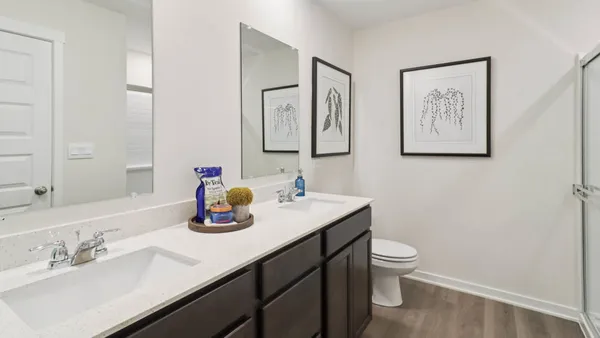a bathroom with a sink toilet and mirror