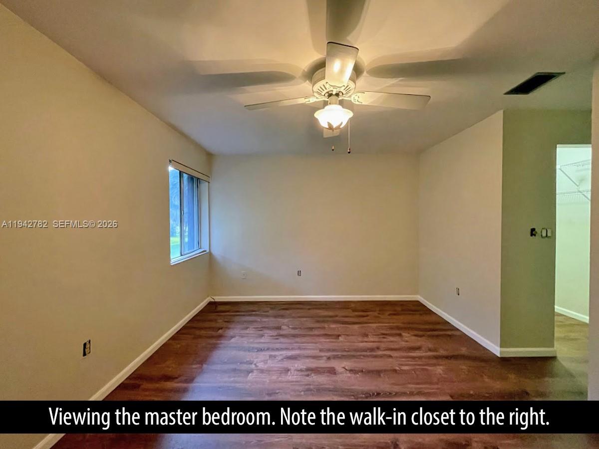 892 Southwest 9th St Circle, Unit 4 Boca Raton, FL 33486 - Photo 14 of 28 a view of an empty room with a window