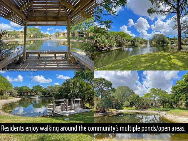 a view of swimming pool with outdoor seating and city view