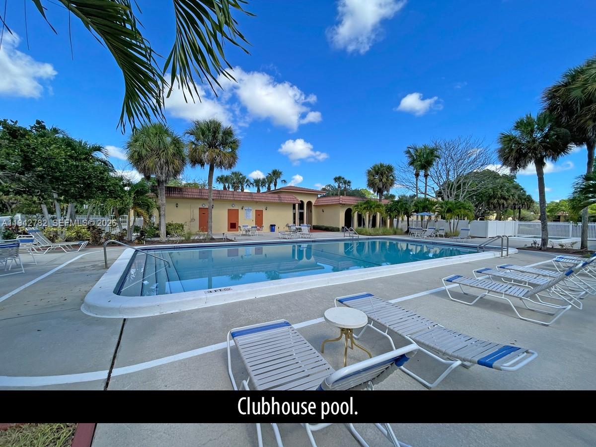 892 Southwest 9th St Circle, Unit 4 Boca Raton, FL 33486 - Photo 20 of 28 a view of swimming pool with outdoor seating and city view