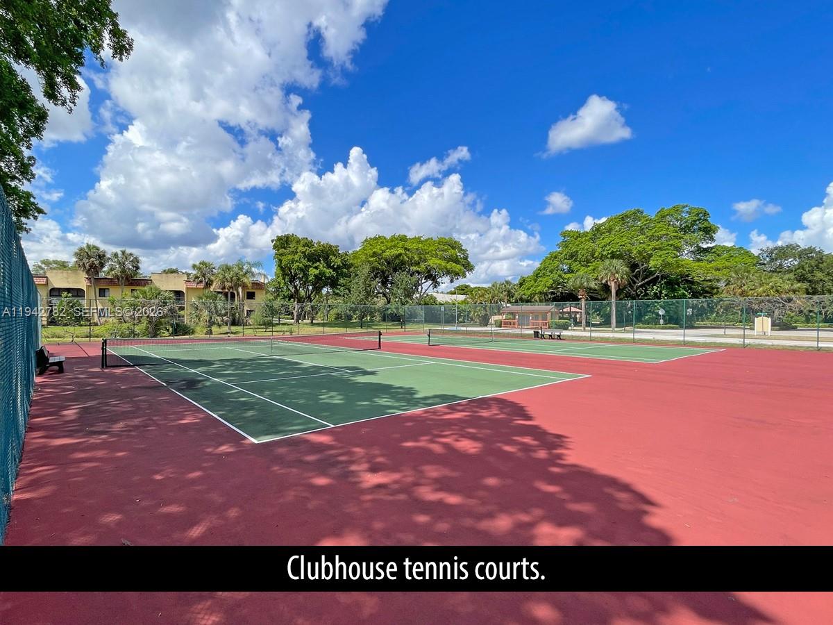 892 Southwest 9th St Circle, Unit 4 Boca Raton, FL 33486 - Photo 23 of 28 a view of a tennis court
