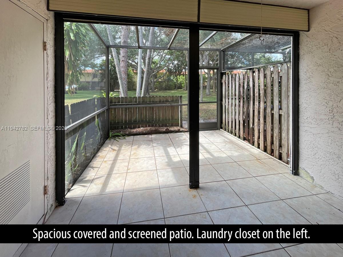 892 Southwest 9th St Circle, Unit 4 Boca Raton, FL 33486 - Photo 9 of 28 a view of a glass door