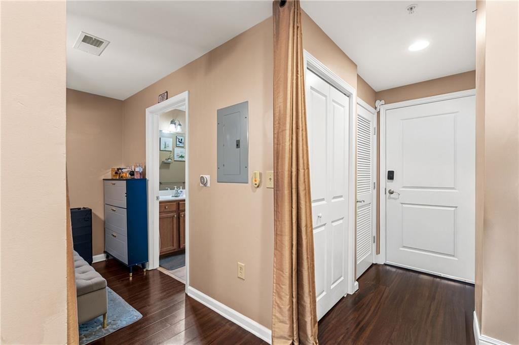 3040 Peachtree Road Northwest, Unit 605 Atlanta, GA 30305 - Photo 12 of 29 a view of a hallway with bathroom and wooden floor