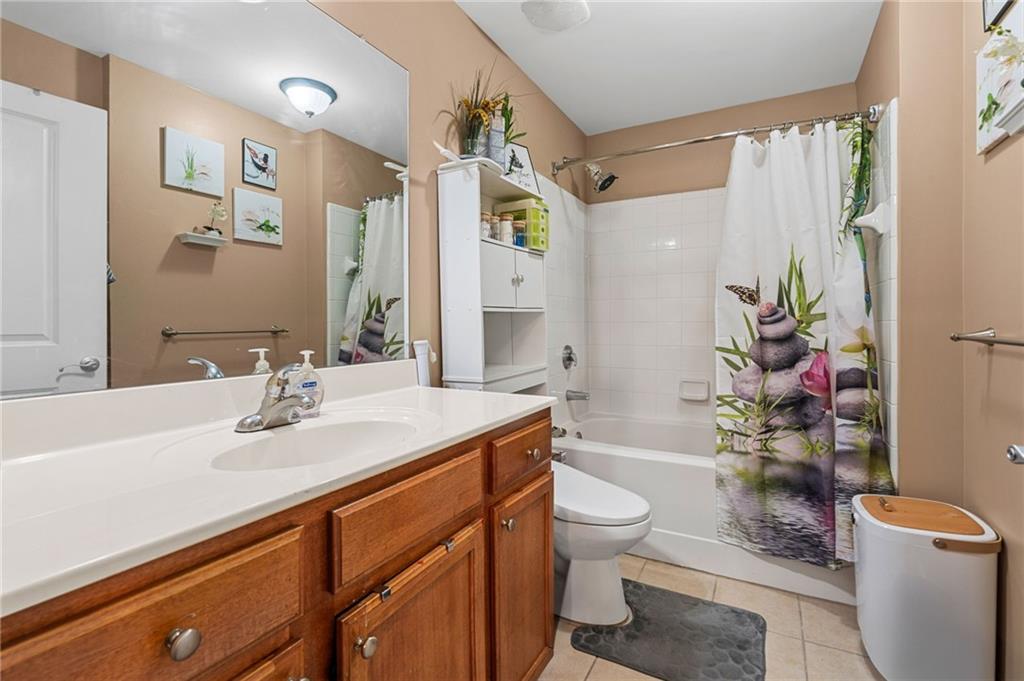 3040 Peachtree Road Northwest, Unit 605 Atlanta, GA 30305 - Photo 21 of 29 a bathroom with a sink a toilet and shower