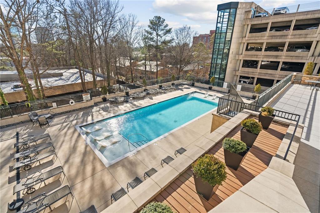 3040 Peachtree Road Northwest, Unit 605 Atlanta, GA 30305 - Photo 29 of 29 a view of a swimming pool with a patio