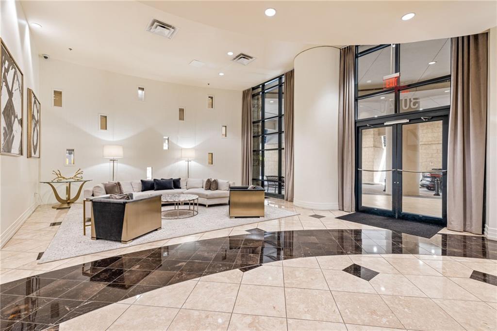 3040 Peachtree Road Northwest, Unit 605 Atlanta, GA 30305 - Photo 3 of 29 a living room with furniture