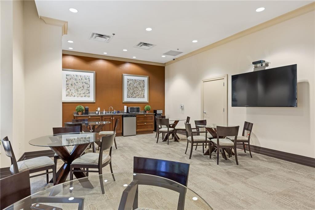 3040 Peachtree Road Northwest, Unit 605 Atlanta, GA 30305 - Photo 5 of 29 a view of a dining room with furniture