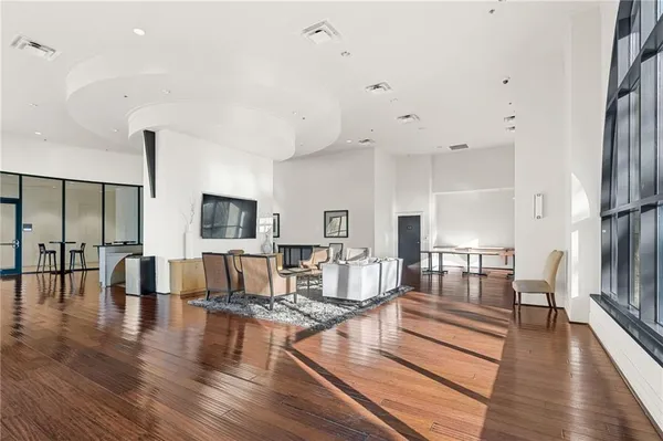 a living room with fireplace furniture and a wooden floor