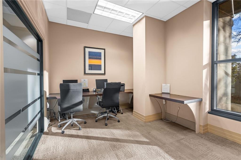 3040 Peachtree Road Northwest, Unit 605 Atlanta, GA 30305 - Photo 9 of 29 a view of a workspace with furniture and a window