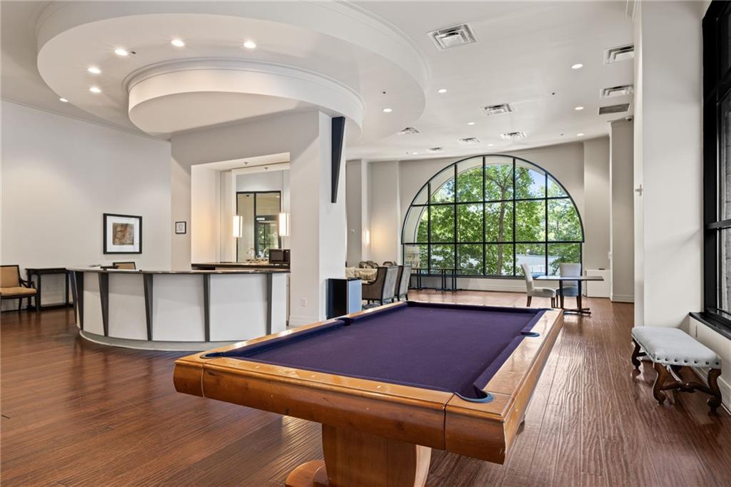 3040 Peachtree Road Northwest, Unit 605 Atlanta, GA 30305 - Photo 10 of 29 a room with lots of furniture and a large window
