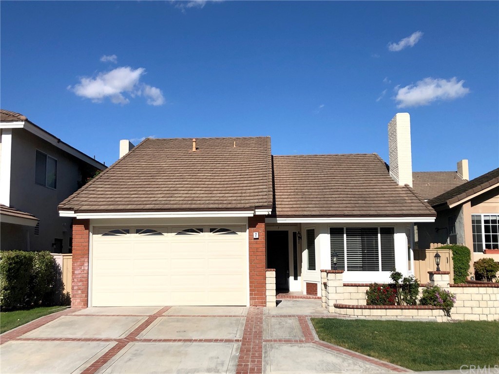 7 Buchanan Irvine, CA 92620 - Photo 2 of 2 a front view of a house with a yard