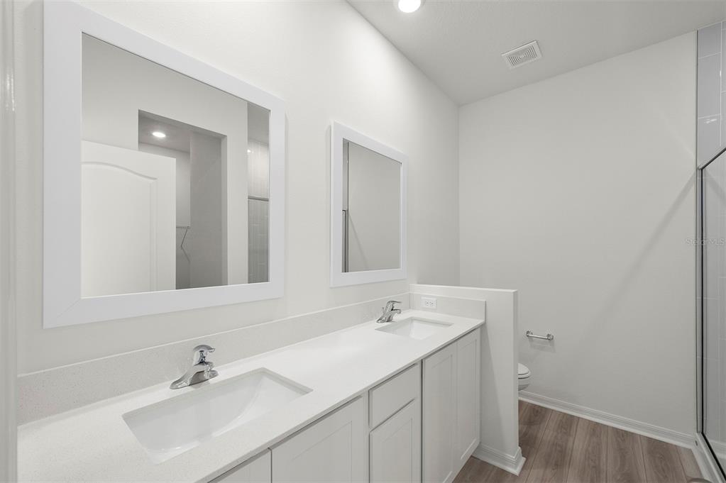13288 Tula Loop Astatula, FL 34705 - Photo 13 of 23 a bathroom with a sink and a mirror