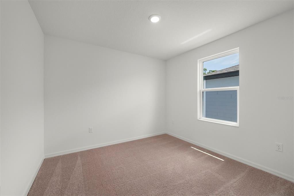 13288 Tula Loop Astatula, FL 34705 - Photo 19 of 23 an empty room with a window