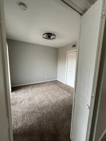 a room with a bed and a window