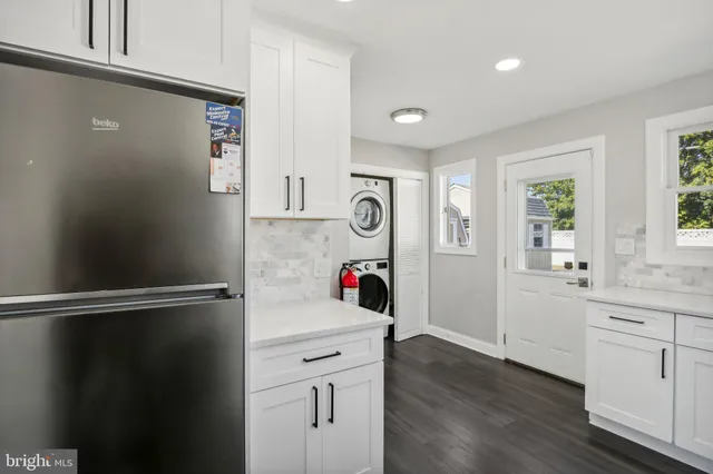 a view of cabinets and wooden floor