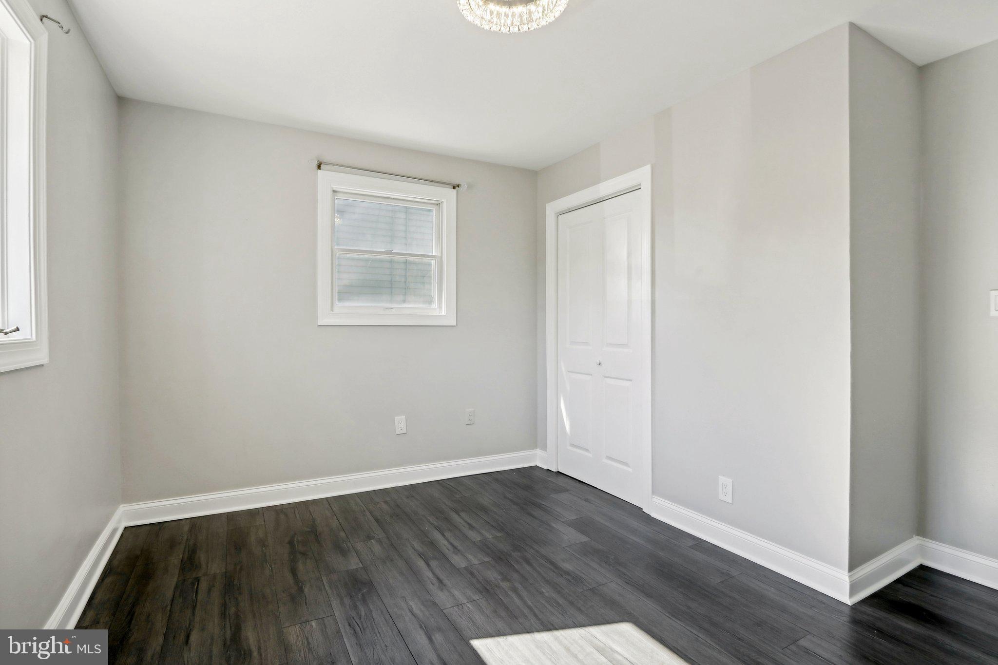 935 Mt Road Burlington, NJ 08016 - Photo 20 of 36 an empty room with wooden floor and windows