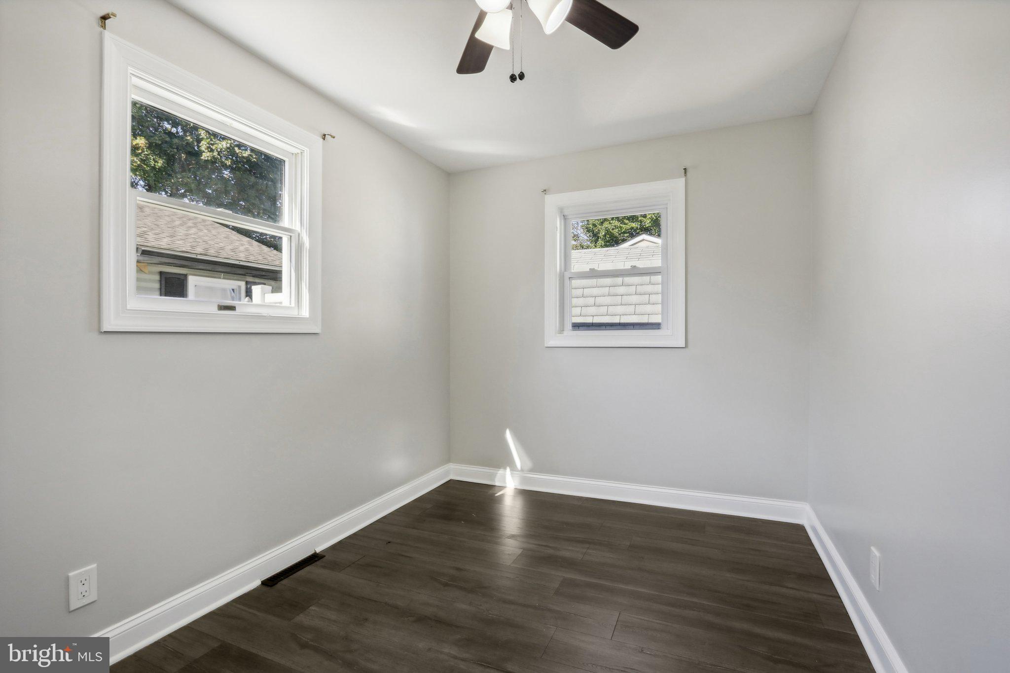 935 Mt Road Burlington, NJ 08016 - Photo 23 of 36 a view of an empty room with wooden floor and a window