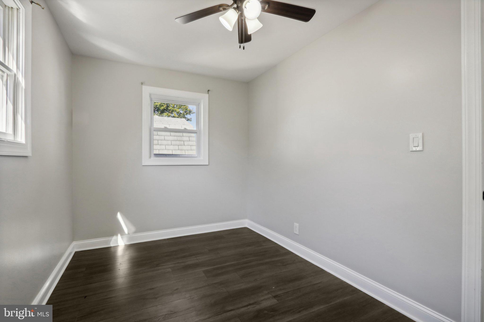 935 Mt Road Burlington, NJ 08016 - Photo 24 of 36 a view of wooden floor chandelier and window in a room