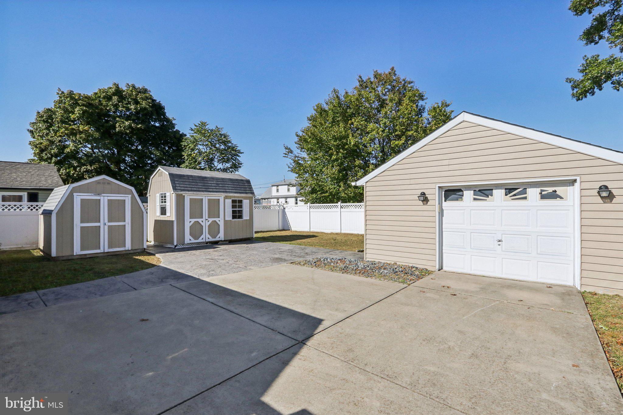 935 Mt Road Burlington, NJ 08016 - Photo 28 of 36 a view of a white house with a yard and potted plants