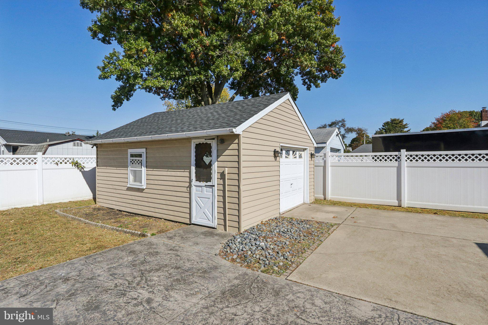 935 Mt Road Burlington, NJ 08016 - Photo 30 of 36 a view of a house with a yard and garage