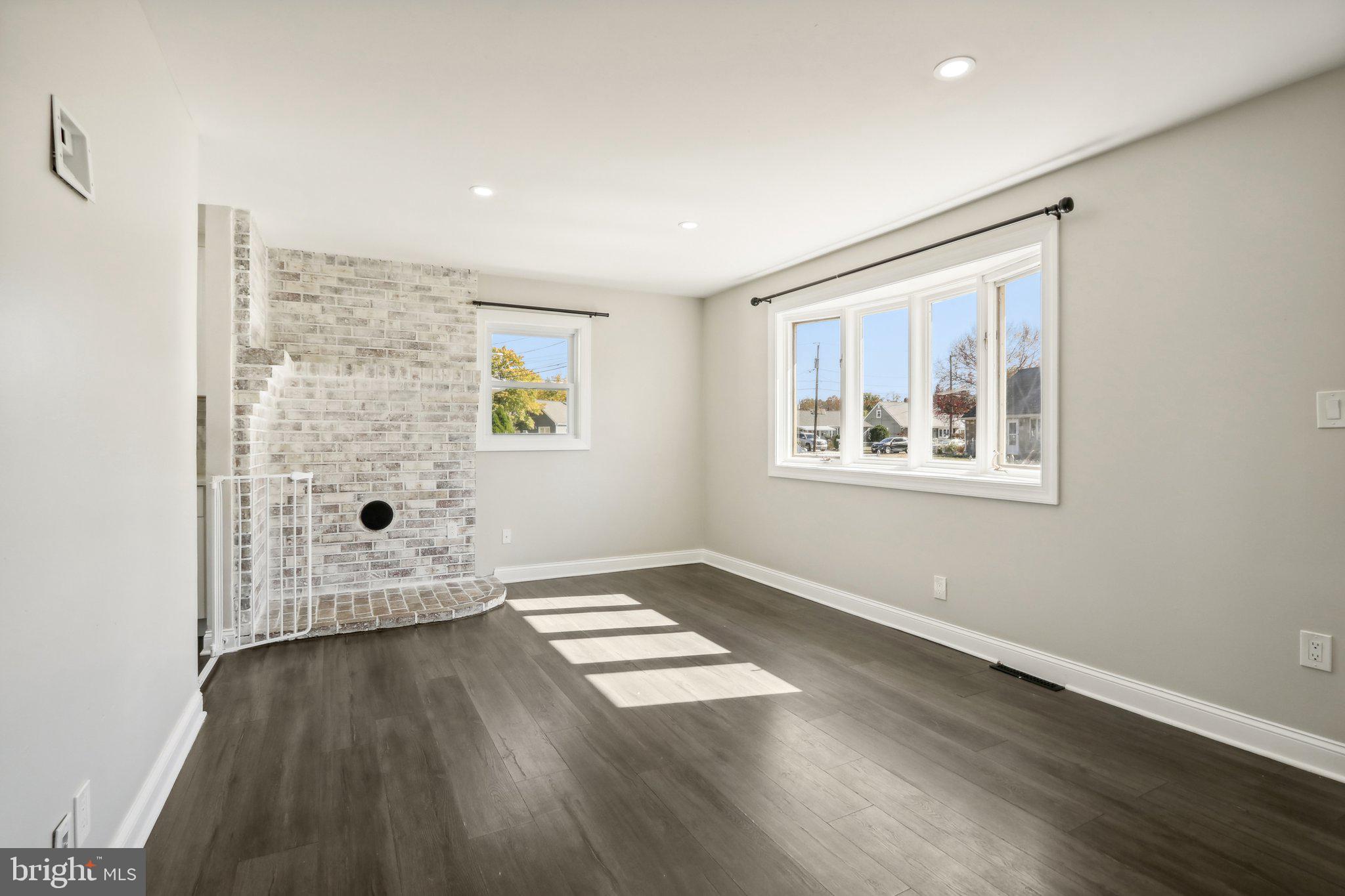 935 Mt Road Burlington, NJ 08016 - Photo 9 of 36 an empty room with wooden floor and windows
