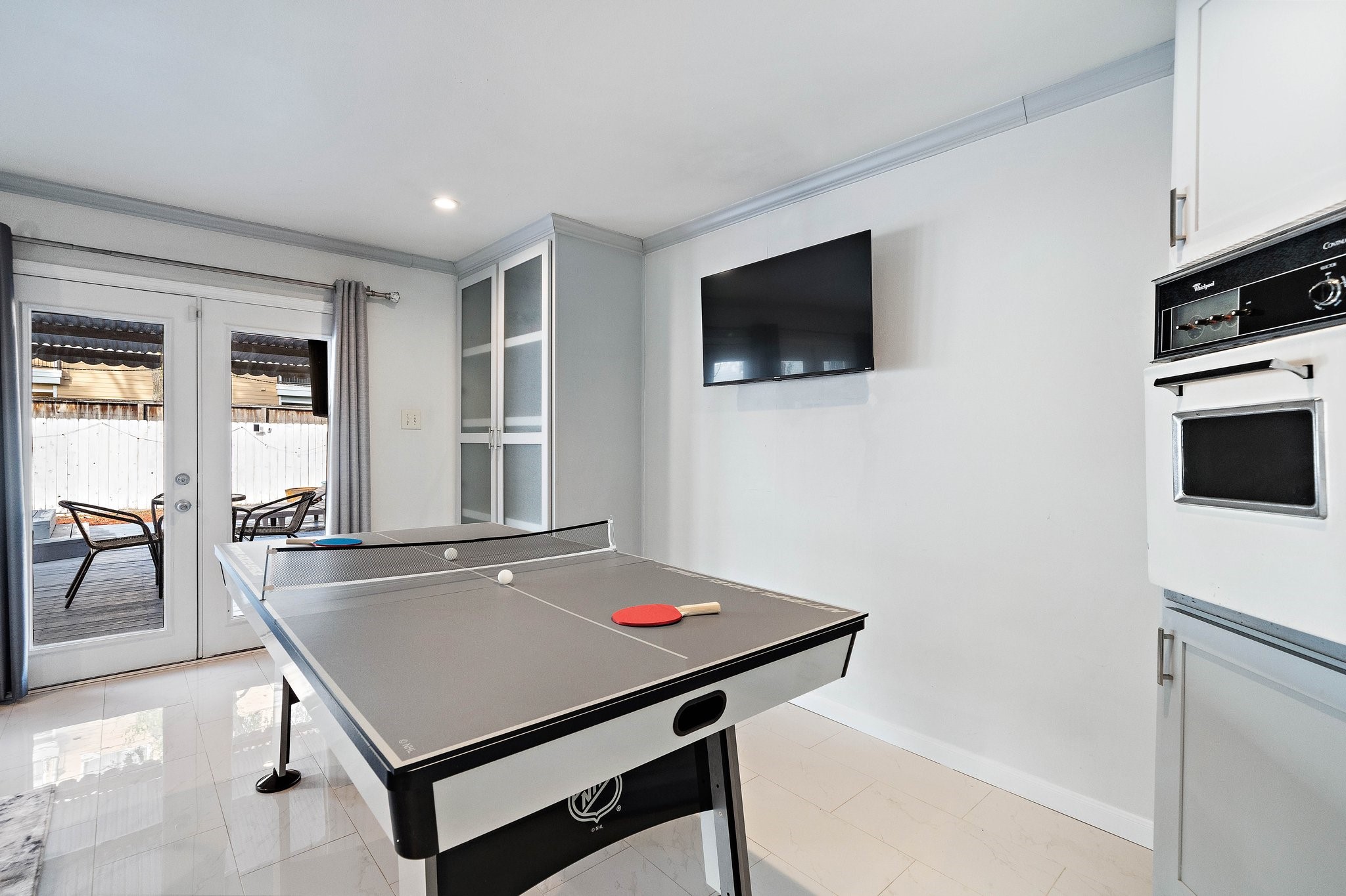 1825 Locksford Street Houston, TX 77008 - Photo 17 of 30 a living room with pool table flat screen tv and windows