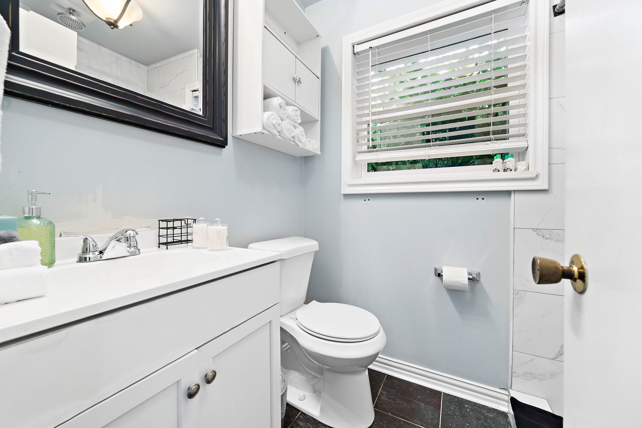 1825 Locksford Street Houston, TX 77008 - Photo 26 of 30 a bathroom with a sink a toilet and a window