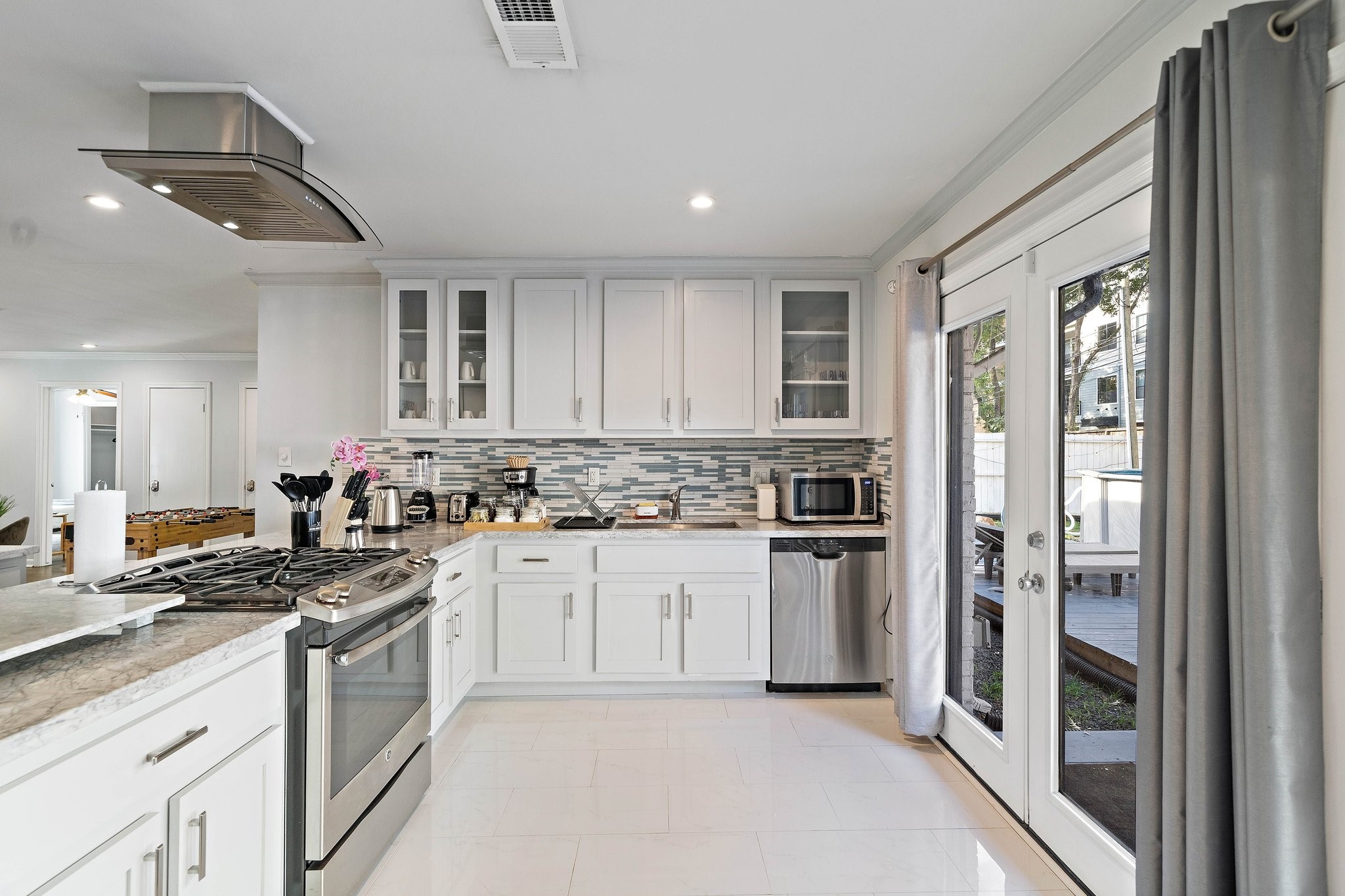 1825 Locksford Street Houston, TX 77008 - Photo 6 of 30 a kitchen with a refrigerator stove top oven and sink
