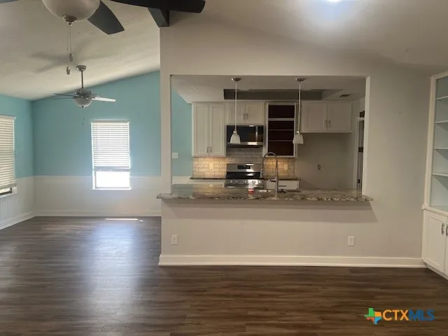 an empty room with wooden floor