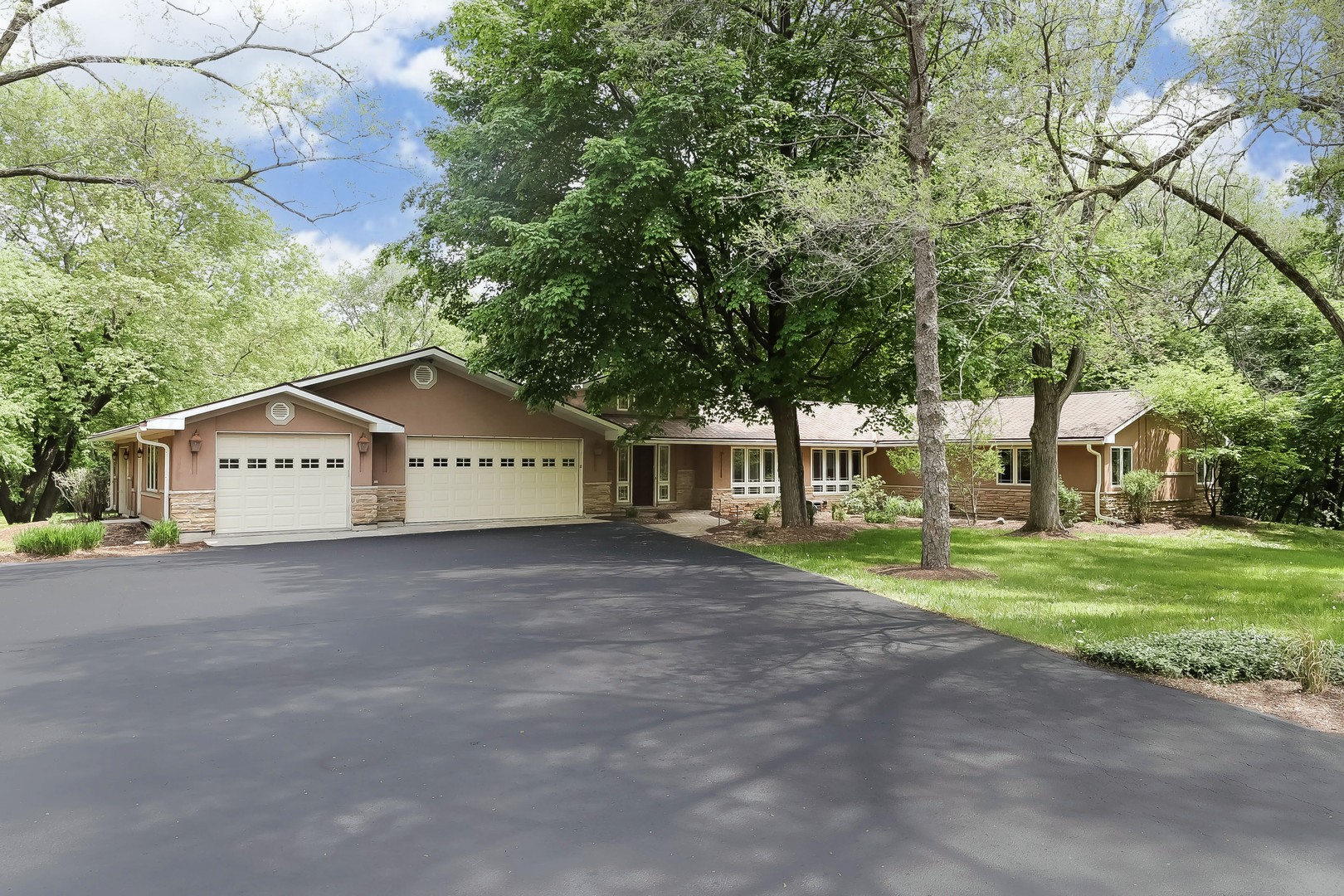 7704 Newbold Road Cary, IL 60013 - Photo 2 of 56 a view of a house with a yard and large trees