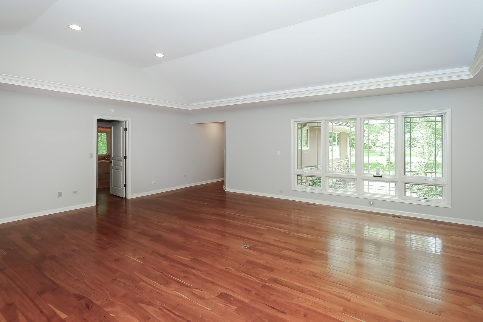 7704 Newbold Road Cary, IL 60013 - Photo 12 of 56 an empty room with wooden floor and windows