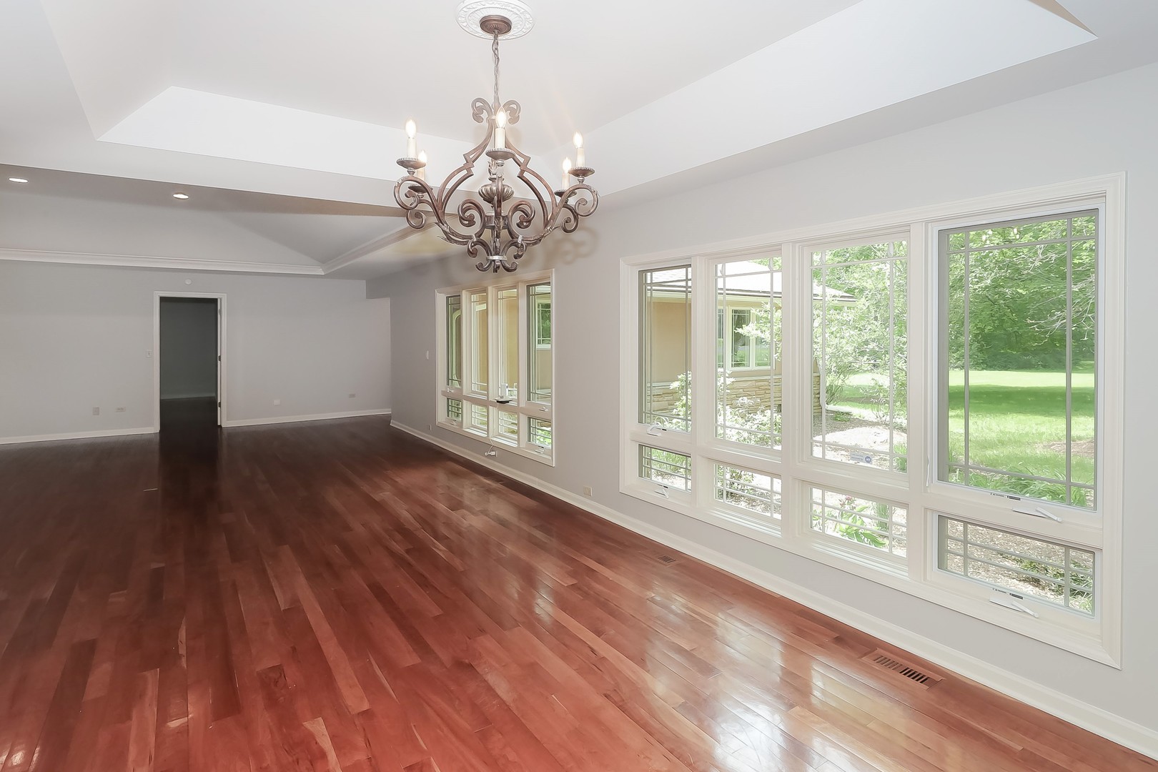 7704 Newbold Road Cary, IL 60013 - Photo 13 of 56 a view of an empty room with wooden floor and a window