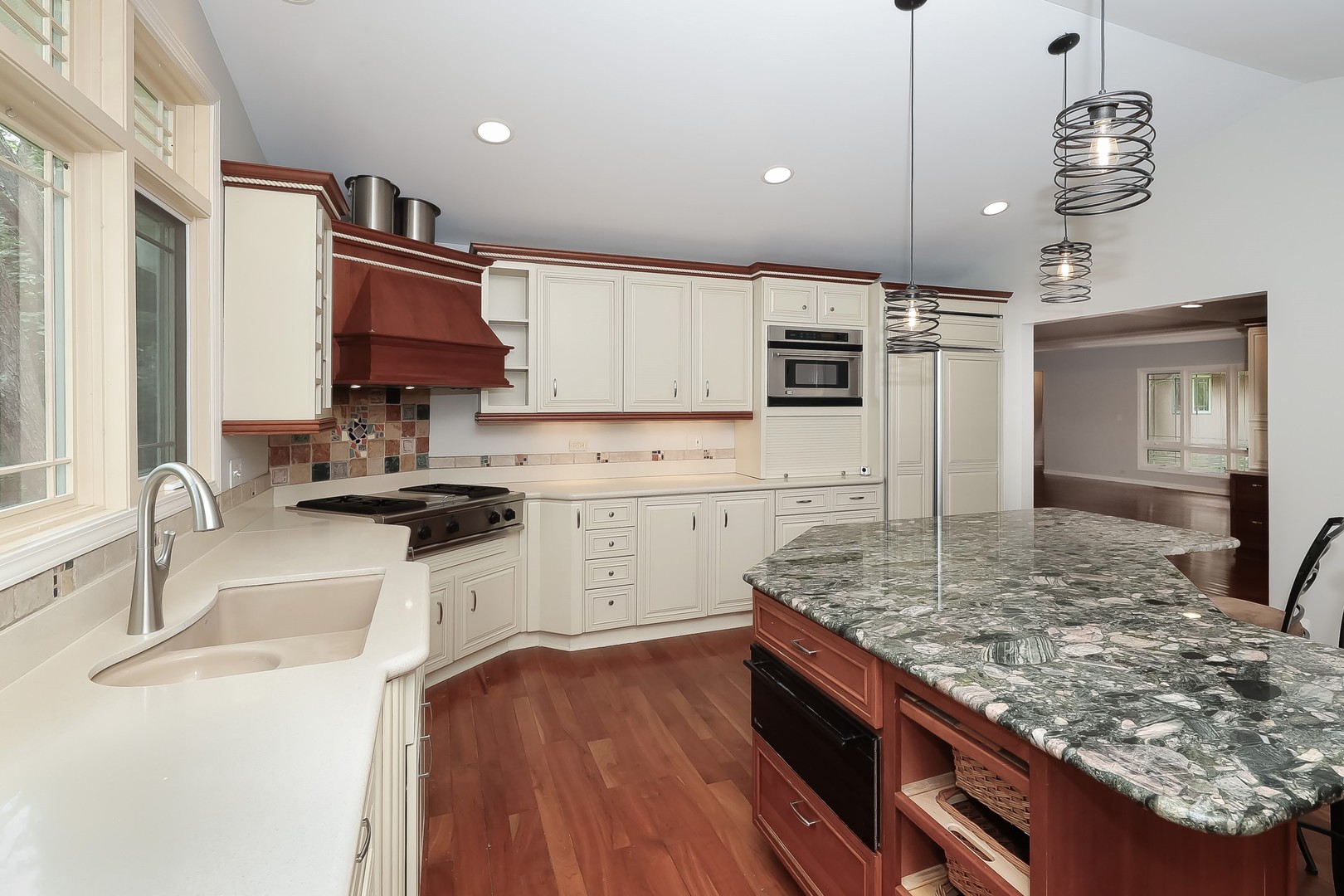 7704 Newbold Road Cary, IL 60013 - Photo 17 of 56 a kitchen with stainless steel appliances granite countertop a sink stove and refrigerator