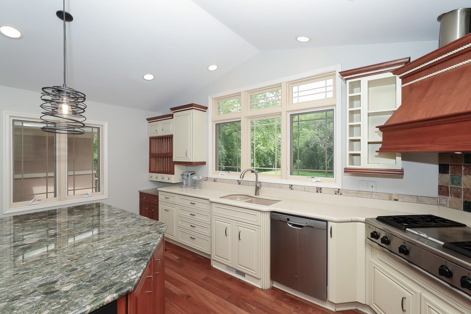 7704 Newbold Road Cary, IL 60013 - Photo 18 of 56 a kitchen with a sink stove and cabinets