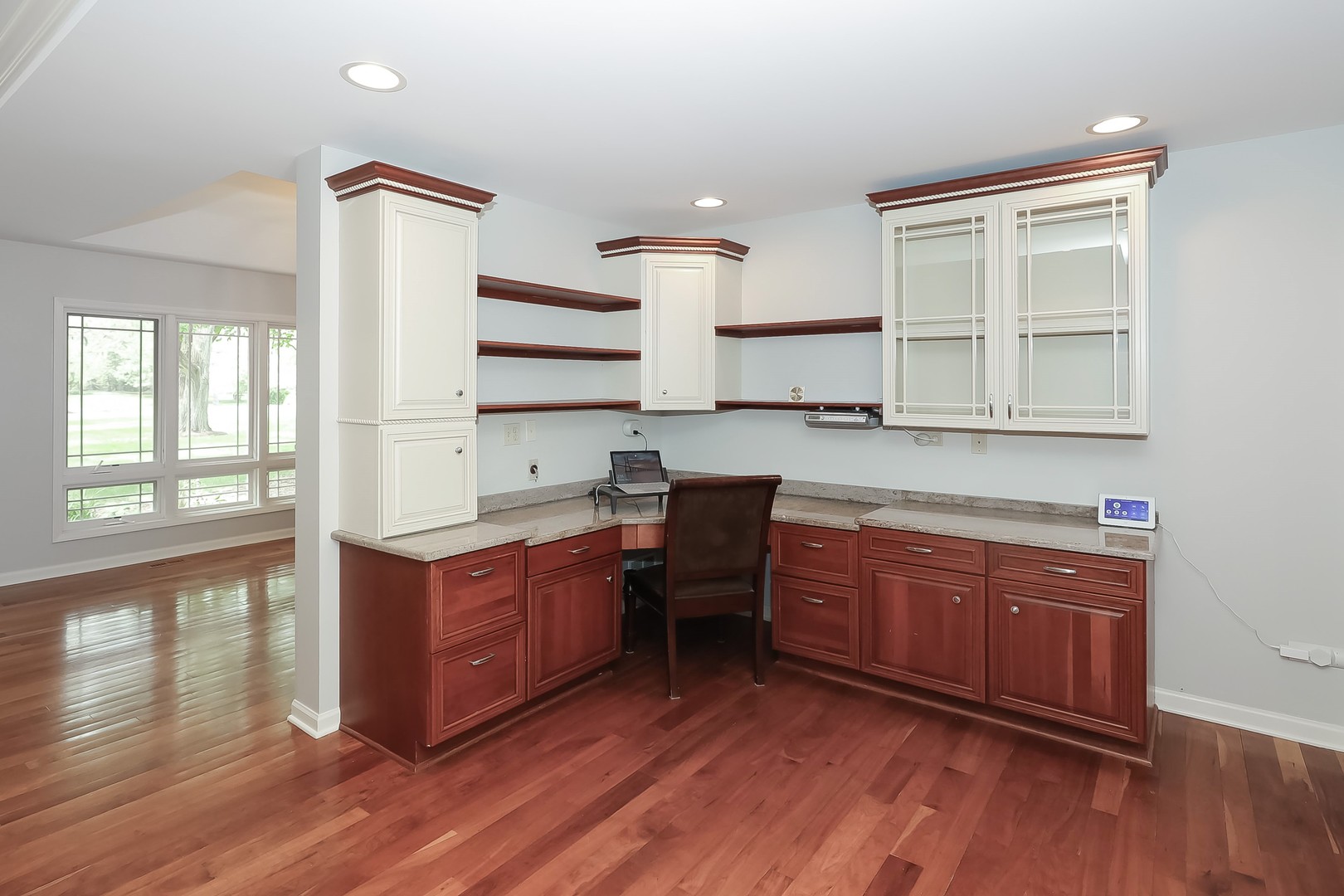 7704 Newbold Road Cary, IL 60013 - Photo 21 of 56 a kitchen with stainless steel appliances granite countertop wooden floors and sink