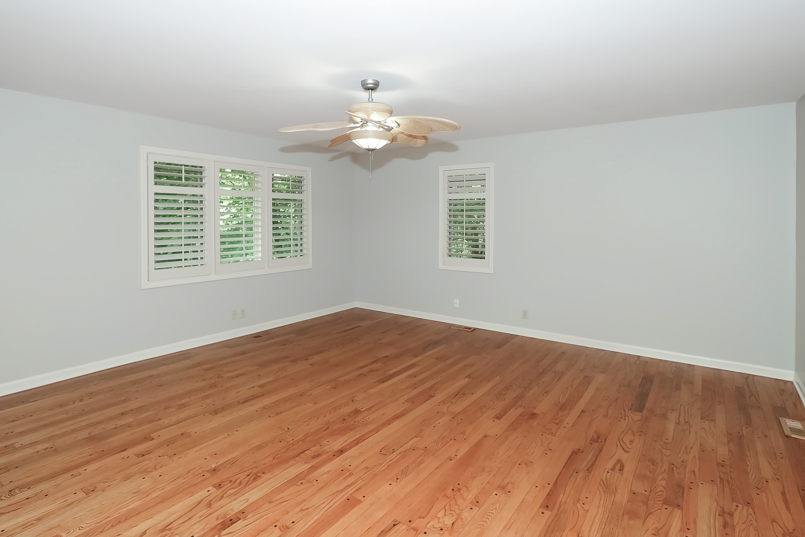 7704 Newbold Road Cary, IL 60013 - Photo 22 of 56 an empty room with wooden floor and windows