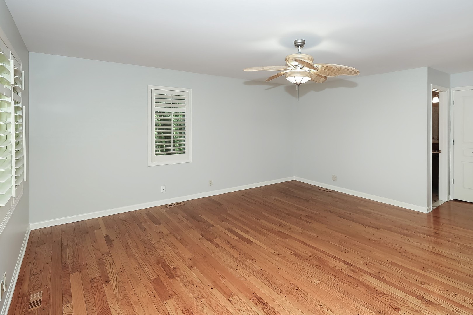7704 Newbold Road Cary, IL 60013 - Photo 23 of 56 wooden floor in an empty room with a window