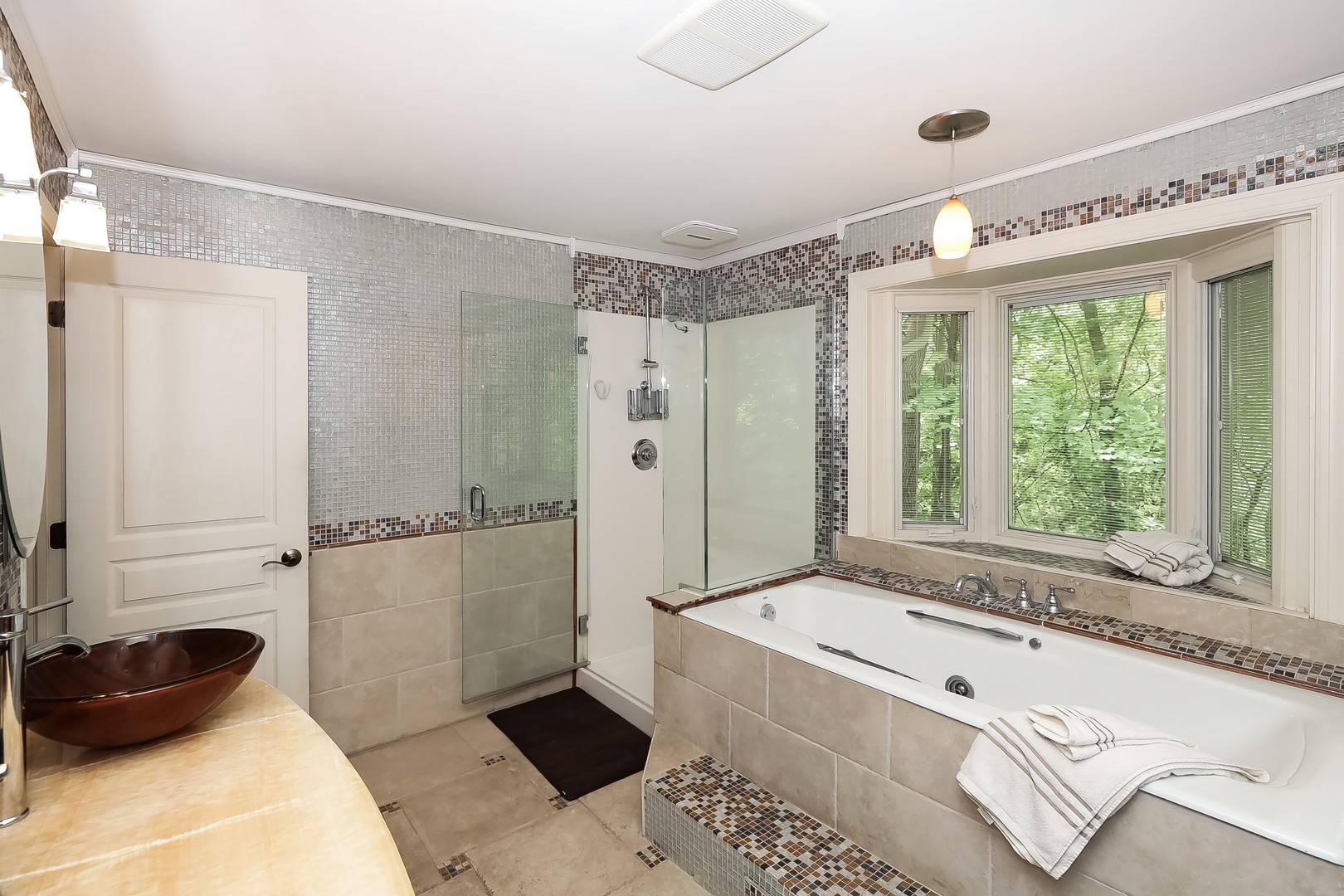 7704 Newbold Road Cary, IL 60013 - Photo 26 of 56 a bathroom with a tub sink and a shower