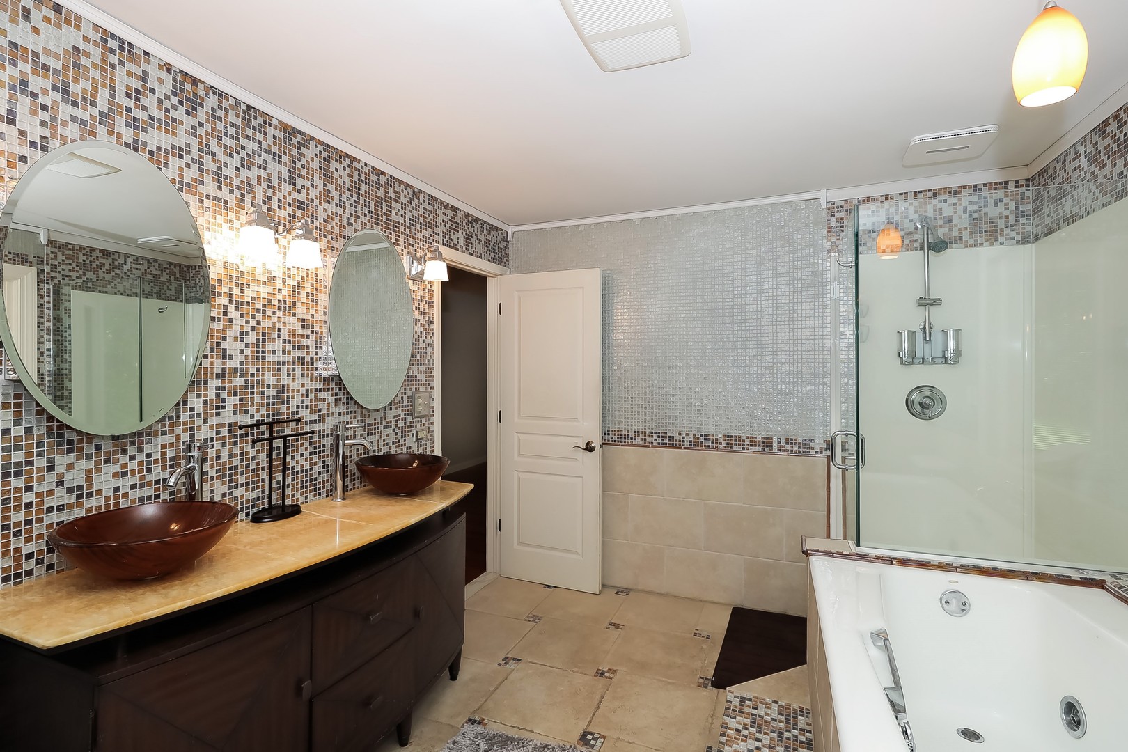 7704 Newbold Road Cary, IL 60013 - Photo 27 of 56 a bathroom with a sink mirror and a shower